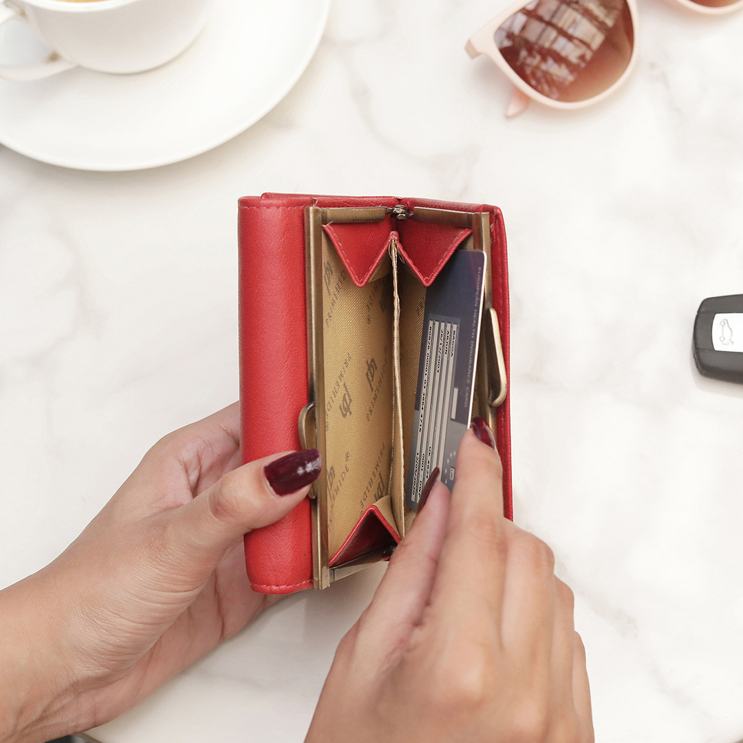 The classic Clip Frame Coin Section adds both elegance and functionality, making this purse a stylish and secure choice for everyday use.