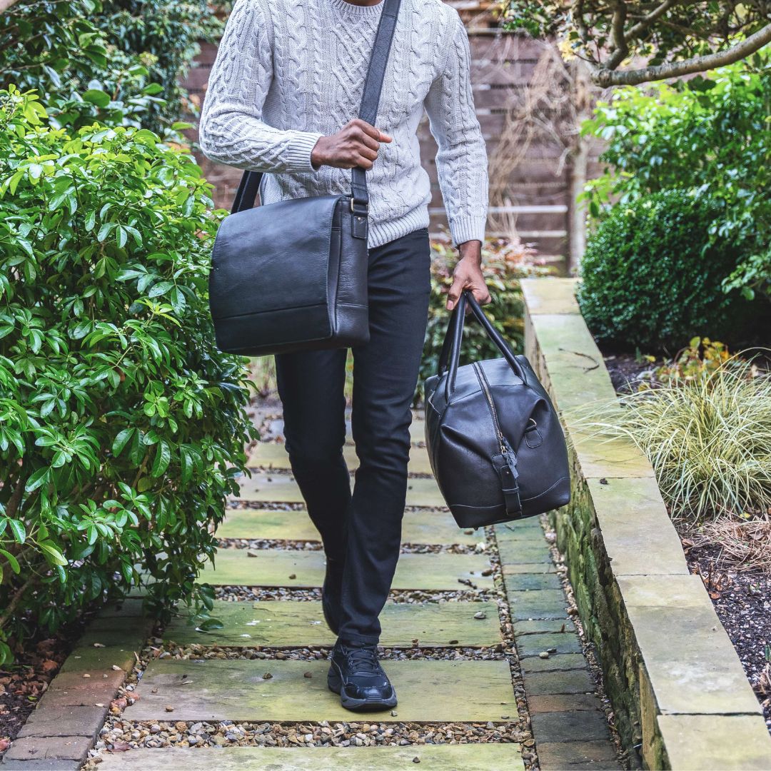 The black leather messenger bag exudes professionalism and style