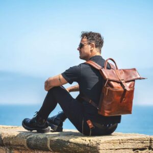 Orion Cognac Roll top Rucksack - 2001 brown leather roll top backpack worn by a stylish man
