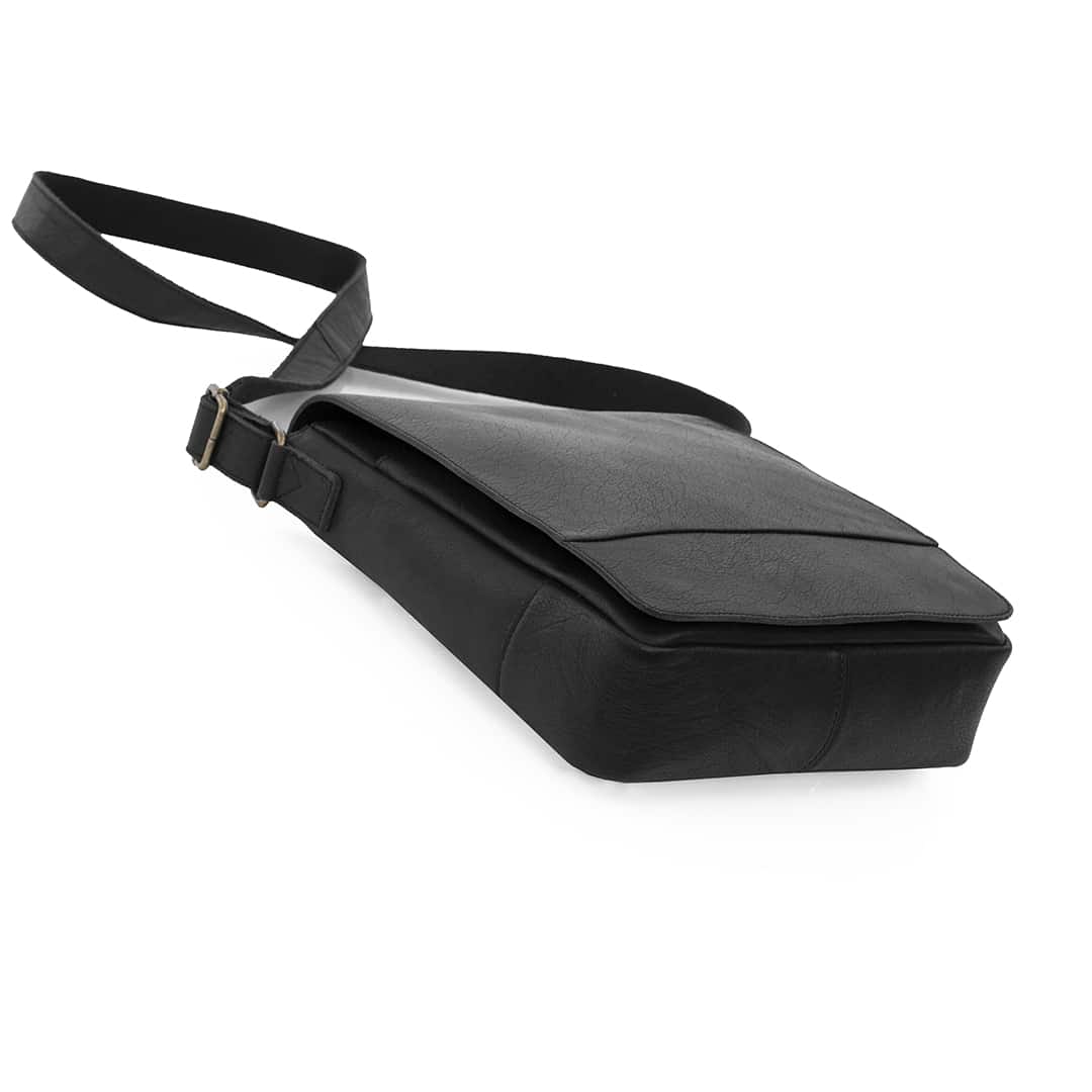 side angle view of a small leather messenger bag