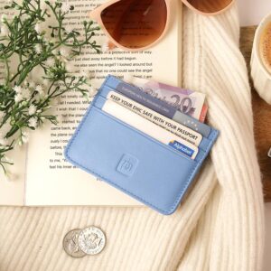 Pastel Blue Personalised Leather Card Holder with RFID 04 Pastel blue leather card holder with cards and cash, styled beside a book, sunglasses, and coffee