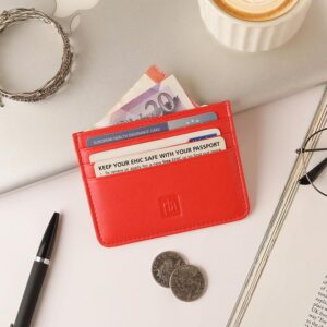 Red Personalised Leather Card Holder with RFID 01 Red leather card holder with cash and cards on a white desk with accessories