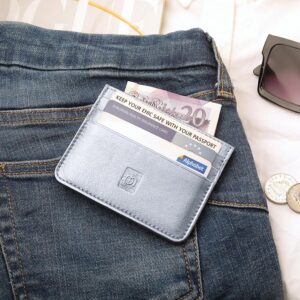 Silver Personalised Leather Card Holder with RFID 01 Silver personalised leather card holder filled with cash and cards, styled on a pair of blue jeans alongside sunglasses and coins.